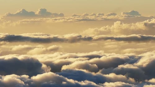 Golden sunset time lapse over the clouds in beautiful Hawaii