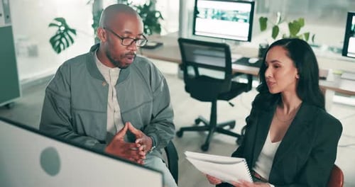 Office, discussion and people with computer at desk for information technology, support or solution