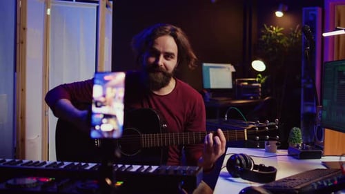 Guitarist Plays Guitar in Music Studio