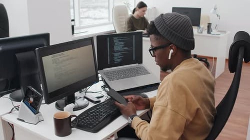 Young Adult Works in a Tech Office