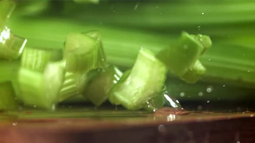 Pieces of Chopped Celery Fall on the Table Filmed on a Highspeed Camera at 1000 Fps