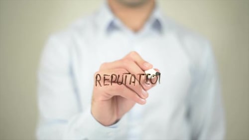 Writing the Word Reputation on Clear Surface