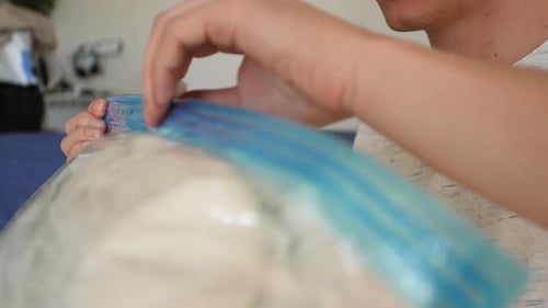 Closing a Vacuum Sealed Bag in a Home