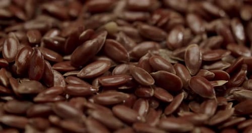 Pile of Shiny Brown Flax Seeds Macro Shot