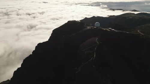 Scenic aerial view on Pico do Arieiro Observatory over clouds, Madeira, Portugal