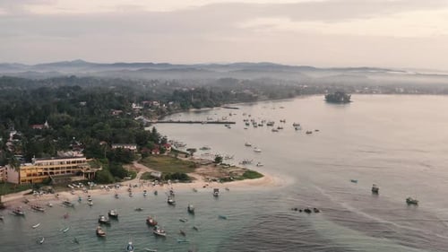Weligama, Sri Lanka Fishing Boats in Sri Lanka. Sri Lankan coast. Aerial cinematic view of Weligama