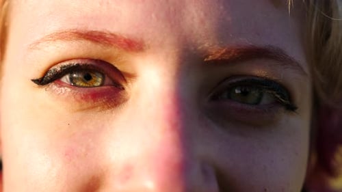 Green Eyes of Beautiful Girl Looking Into Camera Outdoor Face of Young Woman Illuminating By Bright