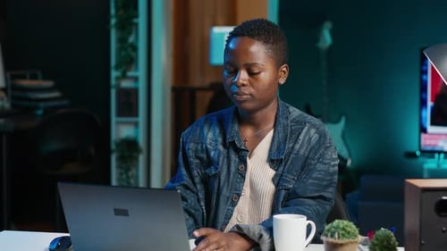 Upbeat Freelancer in Front of Digital Device