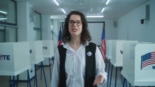 Woman Explains Voting Process at Polling Place