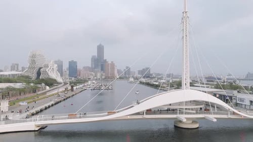 Great Harbor Bridge and many signature buildings in the background, drone view