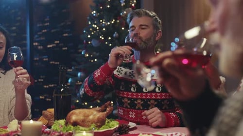 Family Celebrates Christmas Holiday Dinner Together