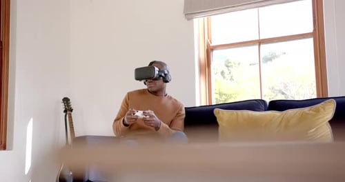 Man on Couch Uses Virtual Reality Headset