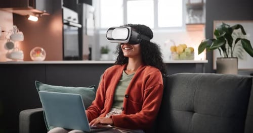 VR, woman and headset on sofa with laptop for interactive metaverse, augmented world or typing
