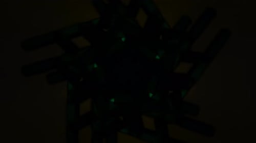 Abstract Animation With Rotating Neon Shapes And Pulsating Effects