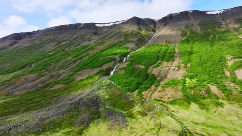 Many Waterfalls Surrounded By Green Bushes and Moss Mountain River Flows Down From Hill River in