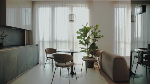 Dolly Shot of Cozy Modern Kitchen the Table and Chairs are By the Window Interior Supplemented with