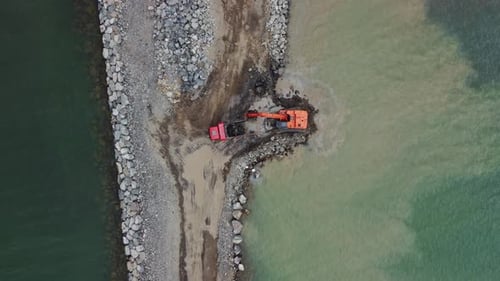 Truck Engineering Coastal Barrier Aerial. Coastal Barrier Building Process