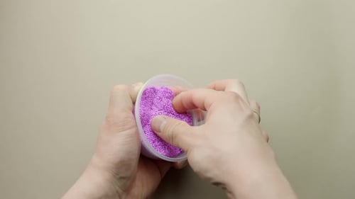 Taking Floam Slime Out of Cup, Then Pushing and Pulling It by Hand