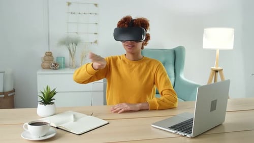 Woman Immersed in Virtual Reality Experience at Home
