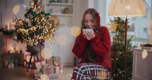 Woman Enjoying Hot Drink During the Christmas Holiday