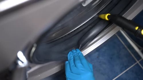 Cleaning Washing Machine Seal With Steam and Sponge