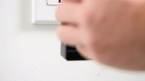 Charger plugged into a wall outlet