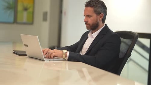 Business Worker with Laptop at Office Employee Remote Working in Modern Office Business Man on