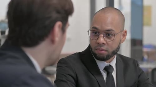 Close up of Multi Ethnic Businessman Talking with Businessman