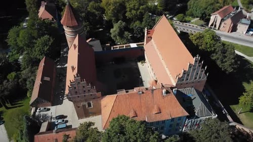 Flight over old medieval castle in a Gothic town in Europe