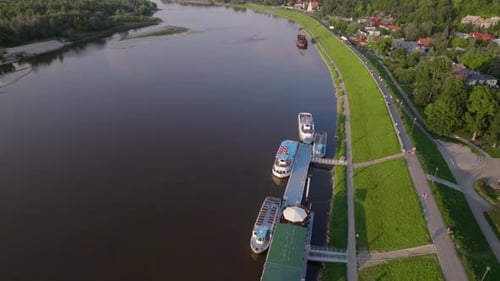 Drone Aerial View of Big River with Pier and Cruise Boats