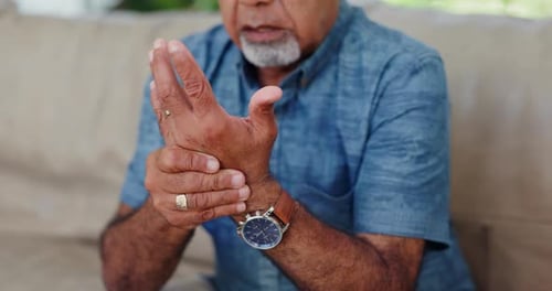 Senior Adult Massaging Hand