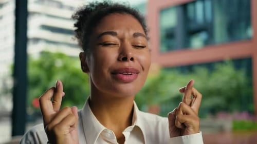 Woman Crossing Fingers Hoping For Good Luck
