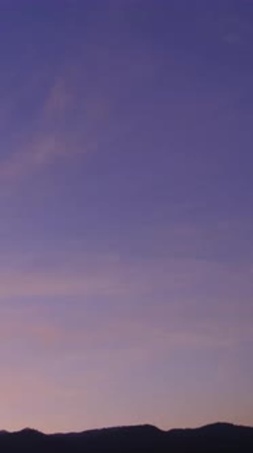 Pink and Purple Sky at Sunrise Over Hills