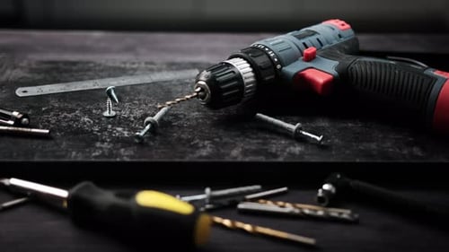 Carpenter Tools and Screws on a Table