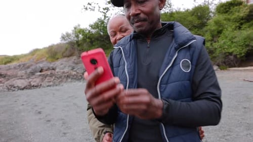 Happy Senior Couple Taking Selfie with Smart Phone on Beach 6064 Years