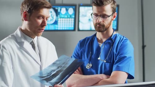 Professional Medical Doctors Working in Hospital Office Using Computer Technology Medicine