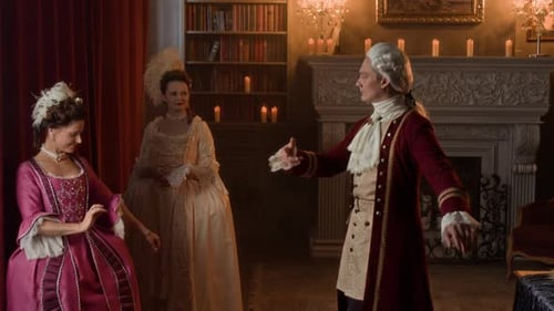 People in period costume indoors with fireplace and candelabra