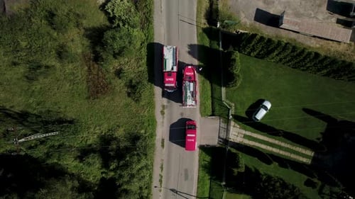 Bird Eye View of Fire Trucks Passing Each Other on the Narrow Road 4k