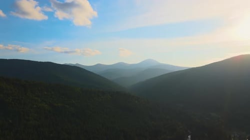 Aerial View of Amazing Scenery with Dark Mountain Hills Covered with Forest Pine Trees at Autumn