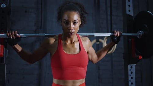 fit young woman training and working out in a industrial styled old gym.