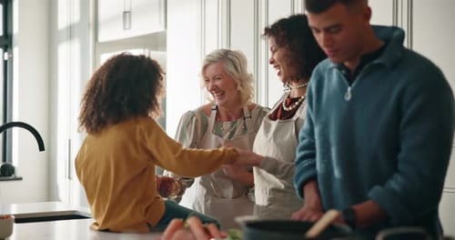 Family Laughing and Dancing in a Kitchen