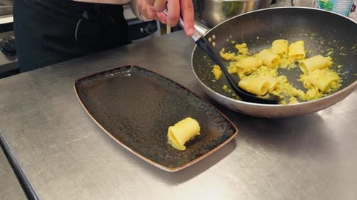 Chef Plates Pasta in Commercial Kitchen