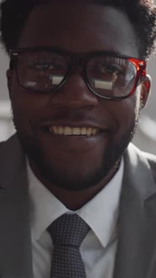 Portrait of Black Businessman with Beaming Smile in Office