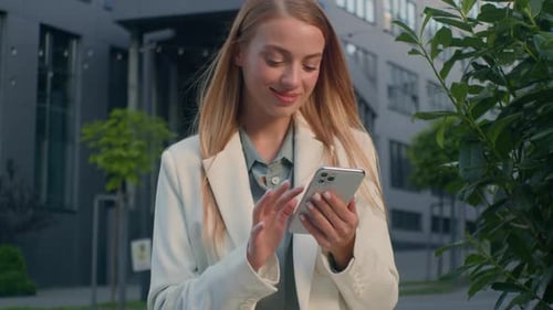Smiling Happy Caucasian Woman Businesswoman Business Lady Female Girl Outdoors Browsing Social Media