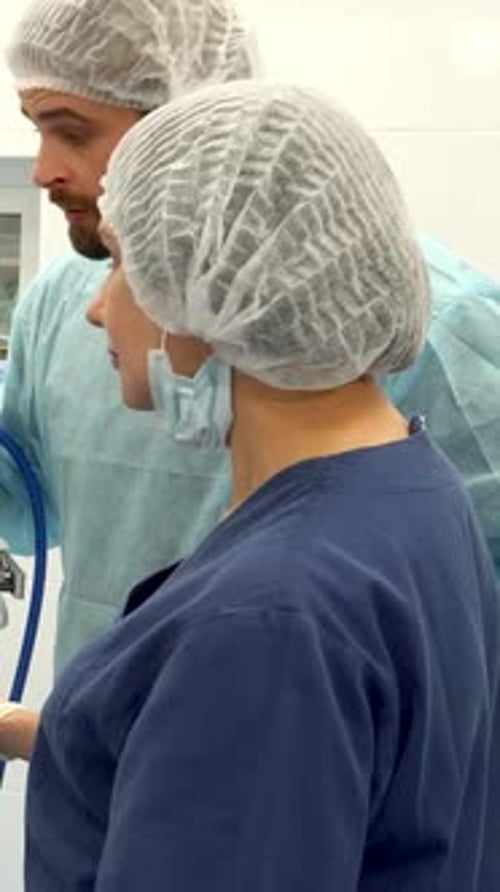Surgical Team Analyzing Data on a Monitor