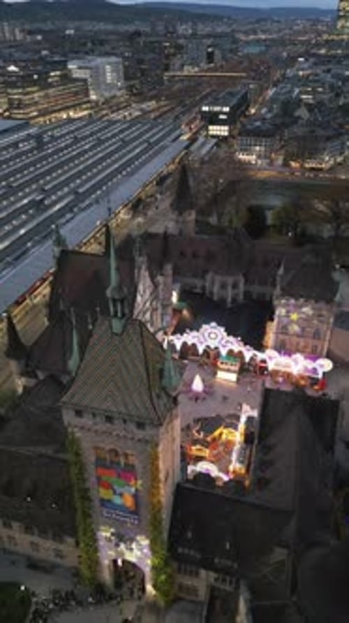 Aerial video of the Swiss National Museum with the city of Zurich, Switzerland in the background