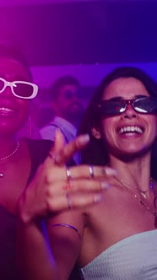 Two Women Dancing at a Nightclub Party