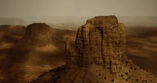 Majestic Rock Formations Under Soft Sunlight at an Arid Desert Landscape
