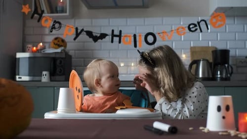 Children Celebrating Halloween in Decorated Kitchen