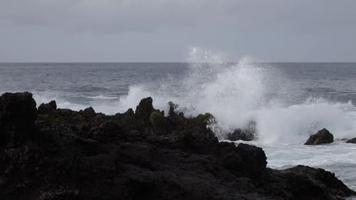 Scenic Landscape of Raging Ocean Waves Crashing on Rocks, Slowmotion